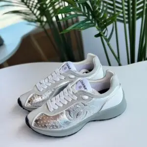 CHANEL CC Logo Laminated Calfskin & Suede Sneakers