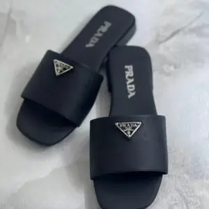 PRADA Plaque Brushed Leather Slides